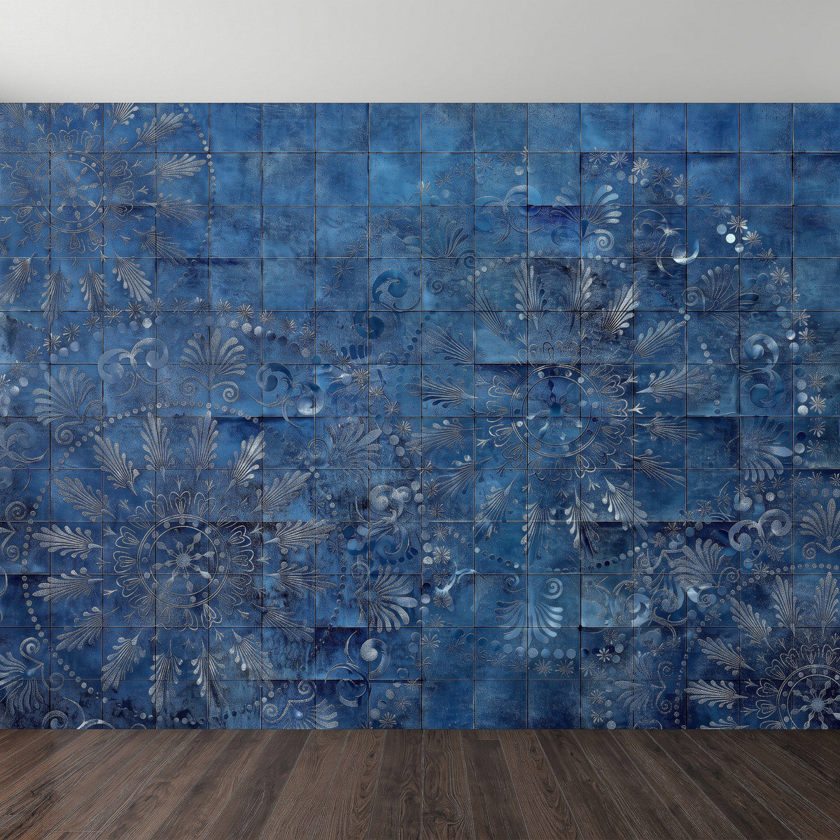 Close-up blue tile wall mural pattern with indigo floral motifs and weathered texture