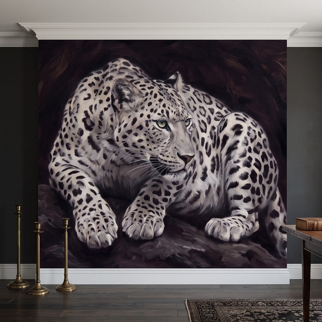 Snow leopard wall mural with a large portrait of a crouching cat and sharp facial details
