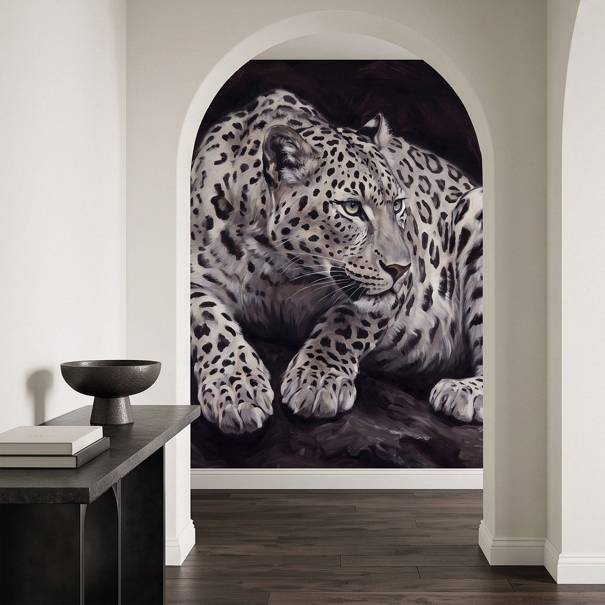 Snow leopard wall mural framed inside an arched opening with a focused, crouching cat