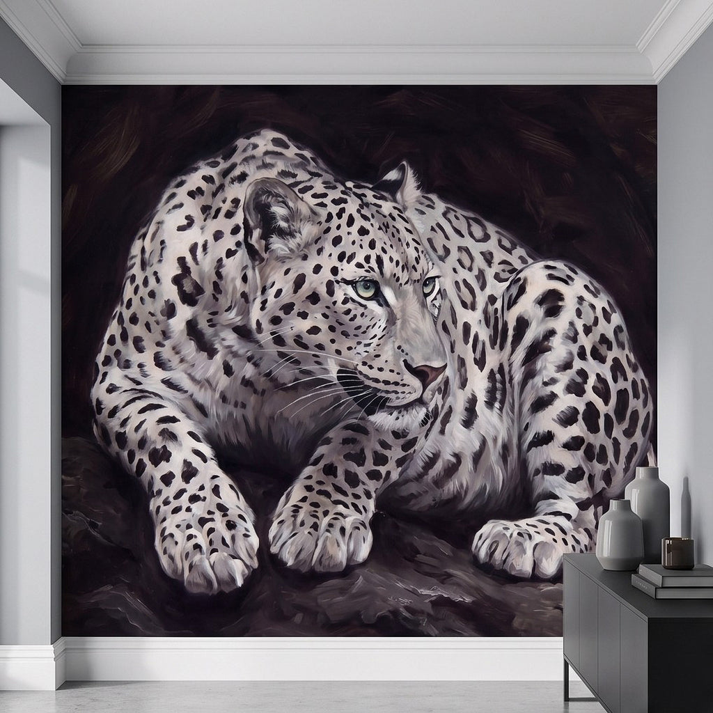 Snow leopard wall mural in a white room with a crouching cat and spotted pattern