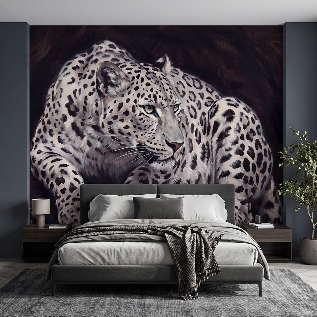 Snow leopard wall mural with large reclining cat, spotted fur and focused stare