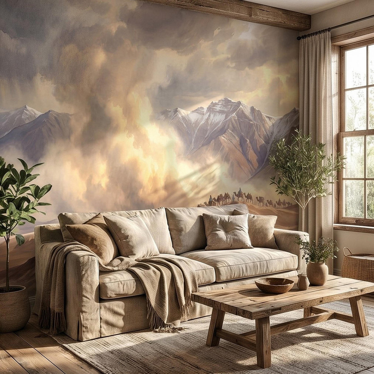 Desert caravan wall mural with camel train along sand dunes and layered mountain peaks